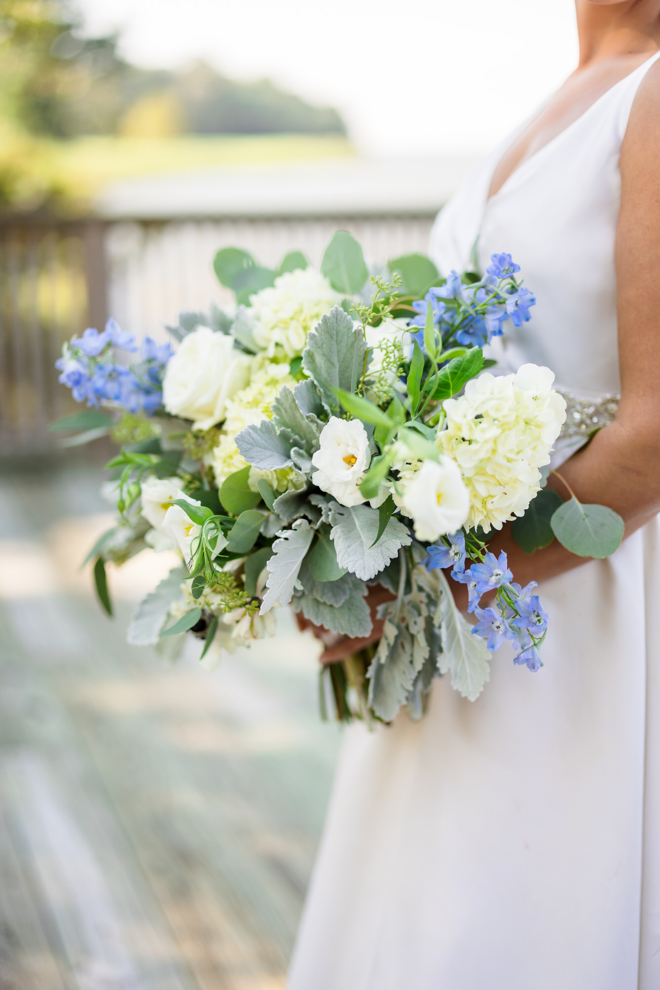 white flowers and green leaves bridal bouquet
