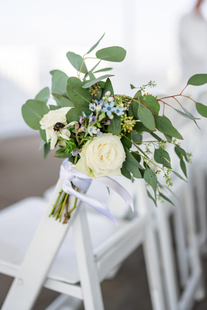 flowers and white bouquet at wedding ceremony