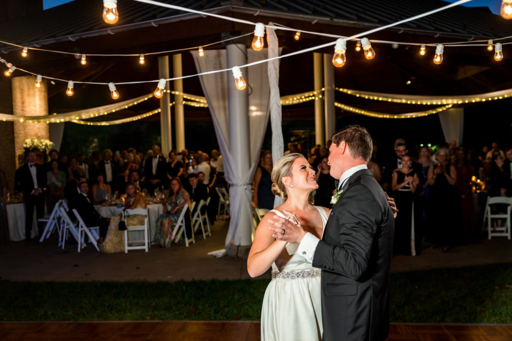 wedding couple dancing during first dance at wedding reception