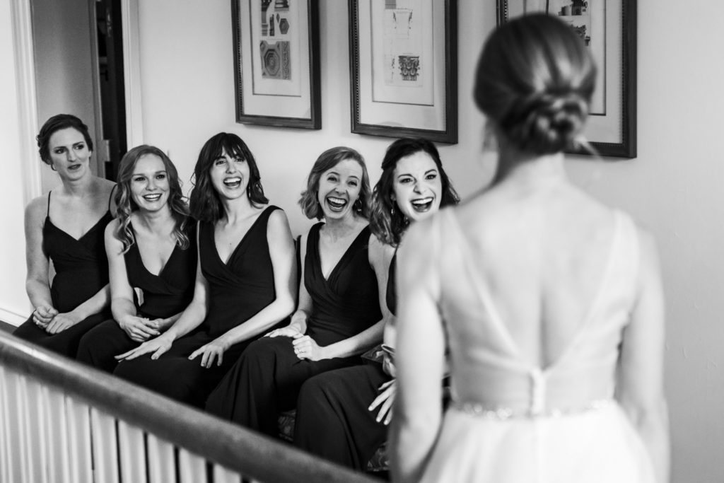 bride doing first look with bridesmaids on wool factory wedding day
