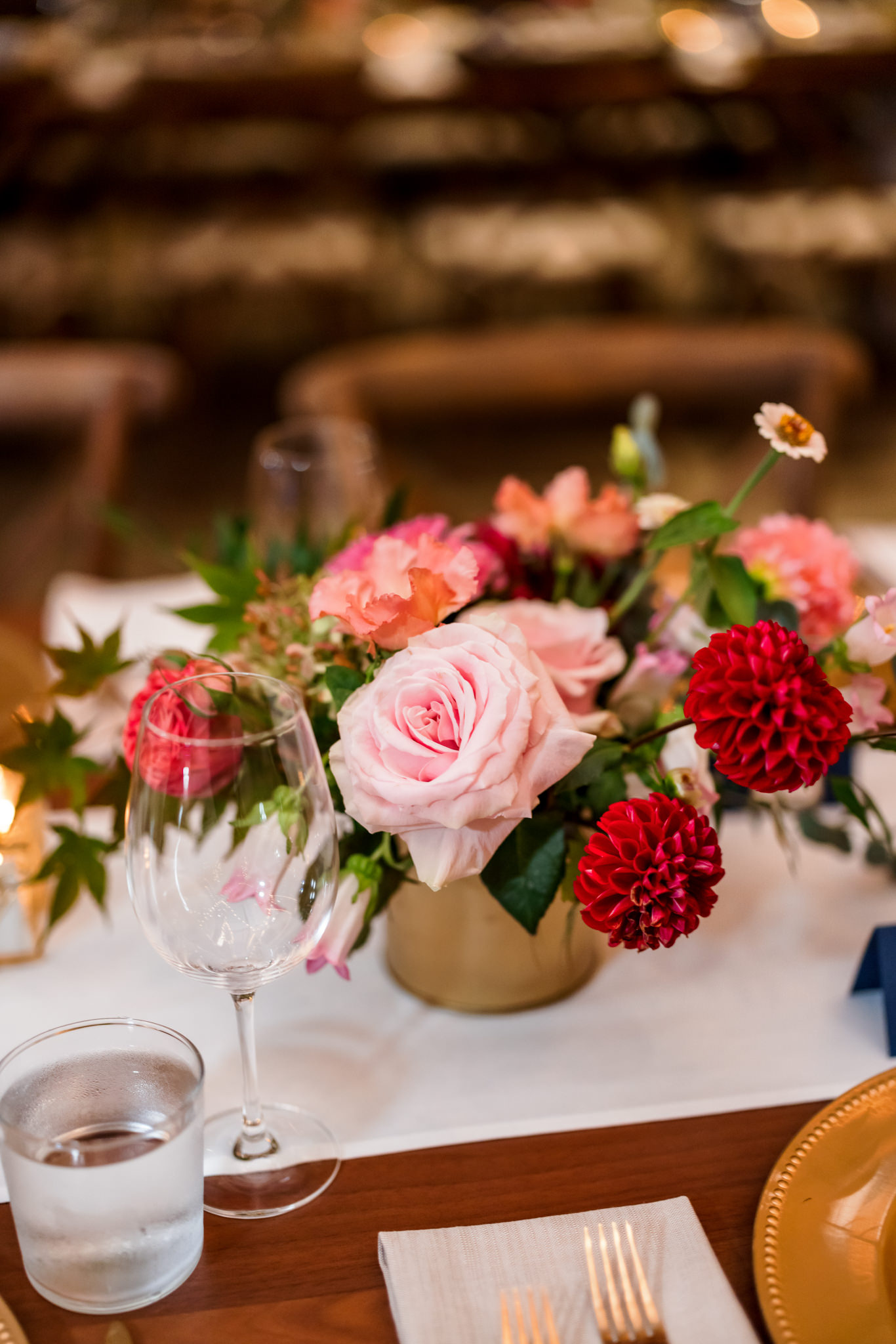 pink, red, and greenery filled centerpieces
