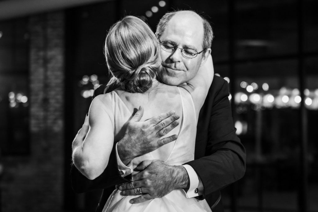 bride hugging dad during first dance 