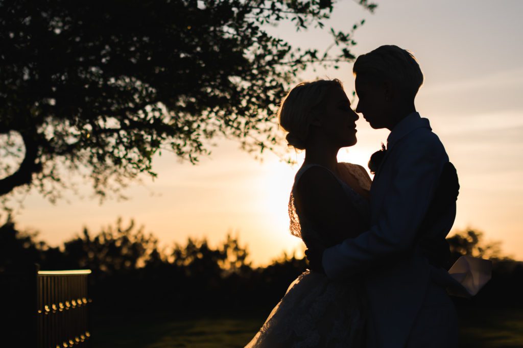 couple posing during bridal portraits at sunset