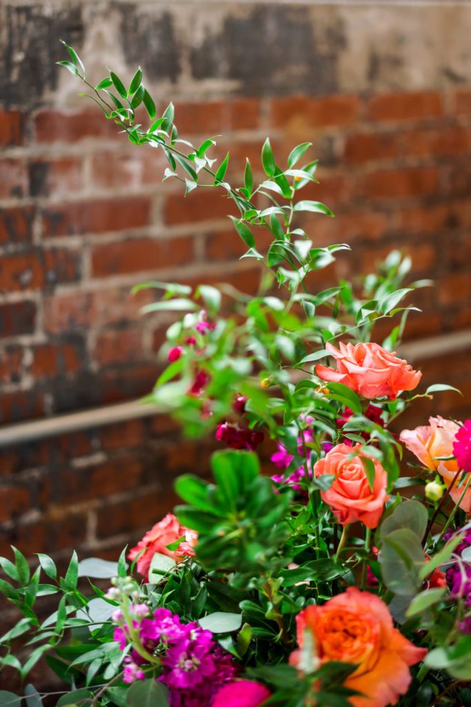 detail shot of floral arrangements at intimate fall Wool Factory wedding