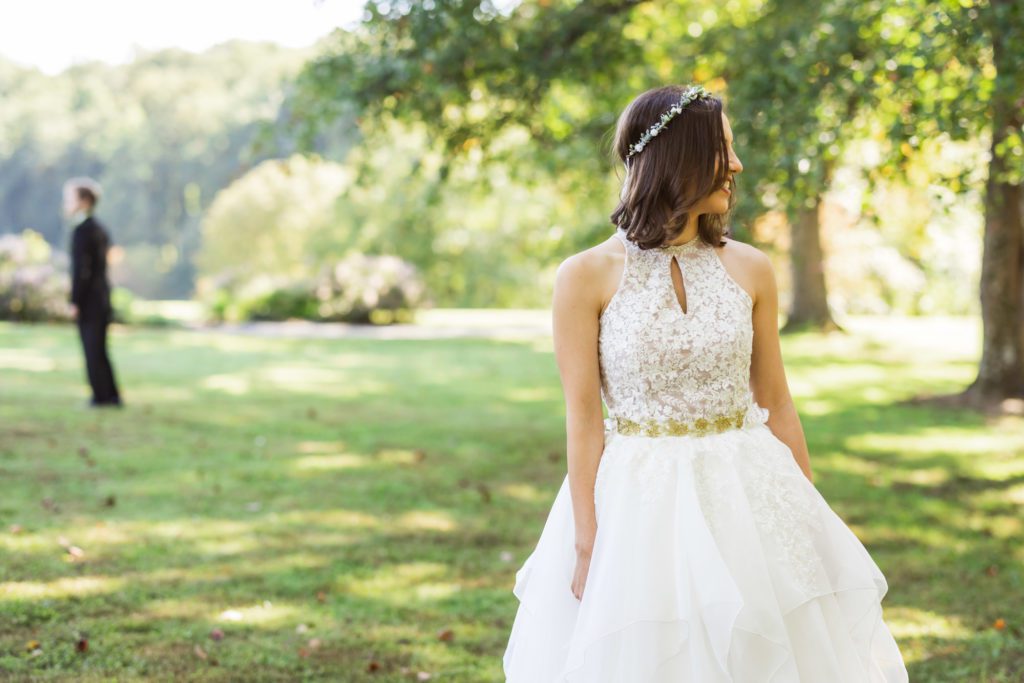 bride walking up to groom during first look at Lebanese-American wedding