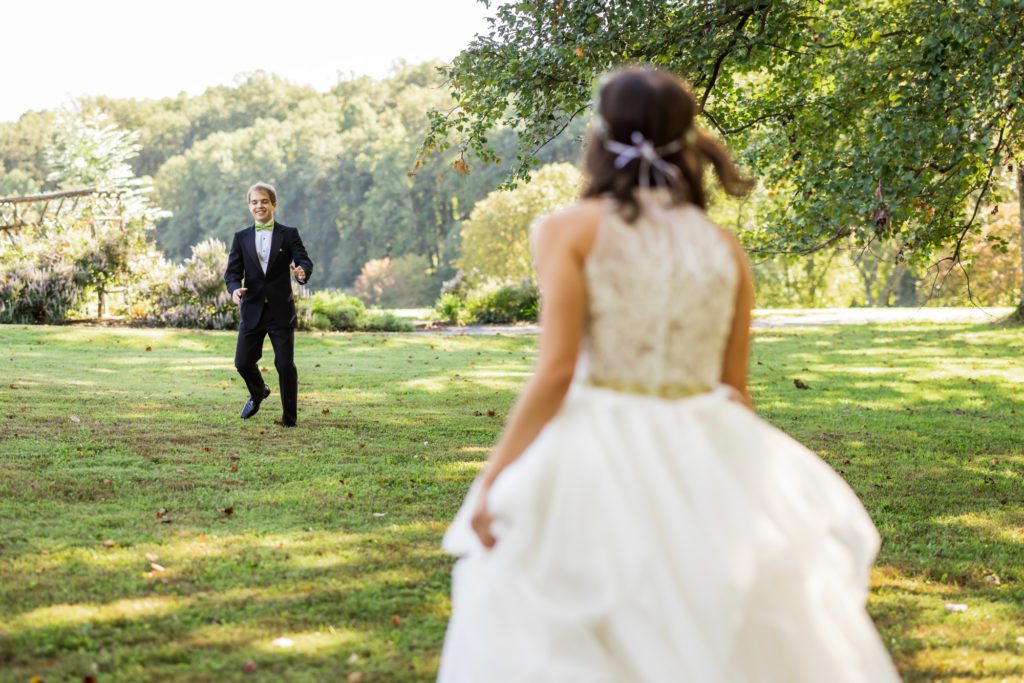 bride and groom seeing one another for first time on wedding day