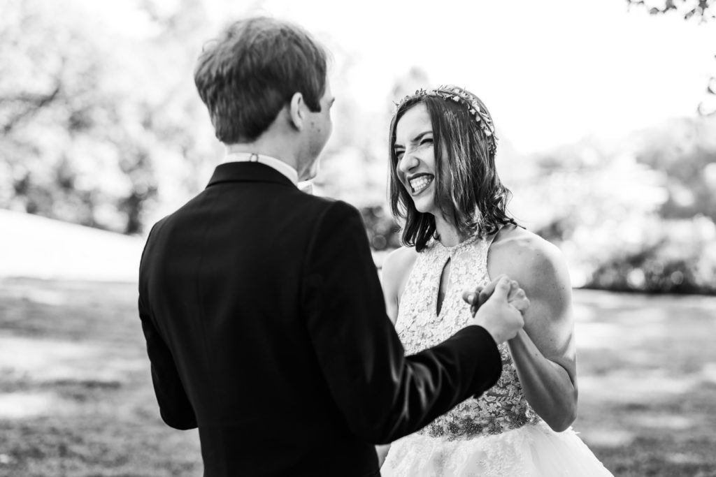 bride and groom smiling and celebrating seeing one another for first time