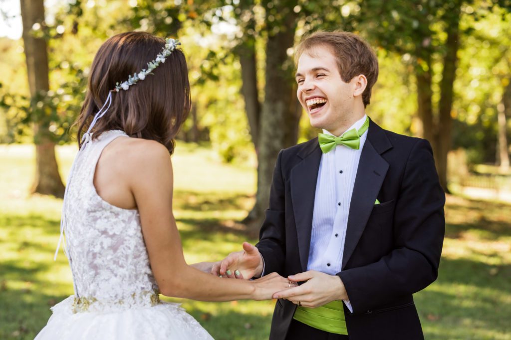 bride and groom laughing together
