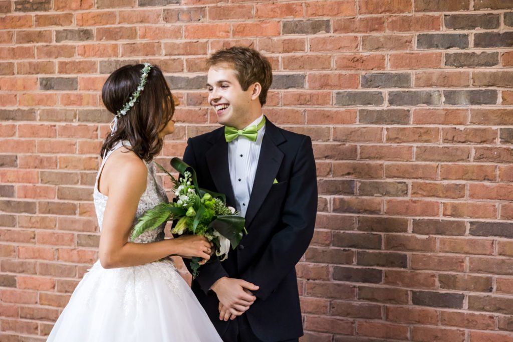 bride and groom smiling together 