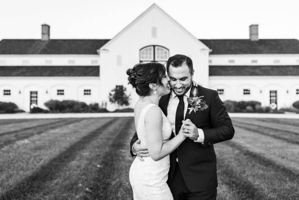 bridal couple dancing in black and white portrait