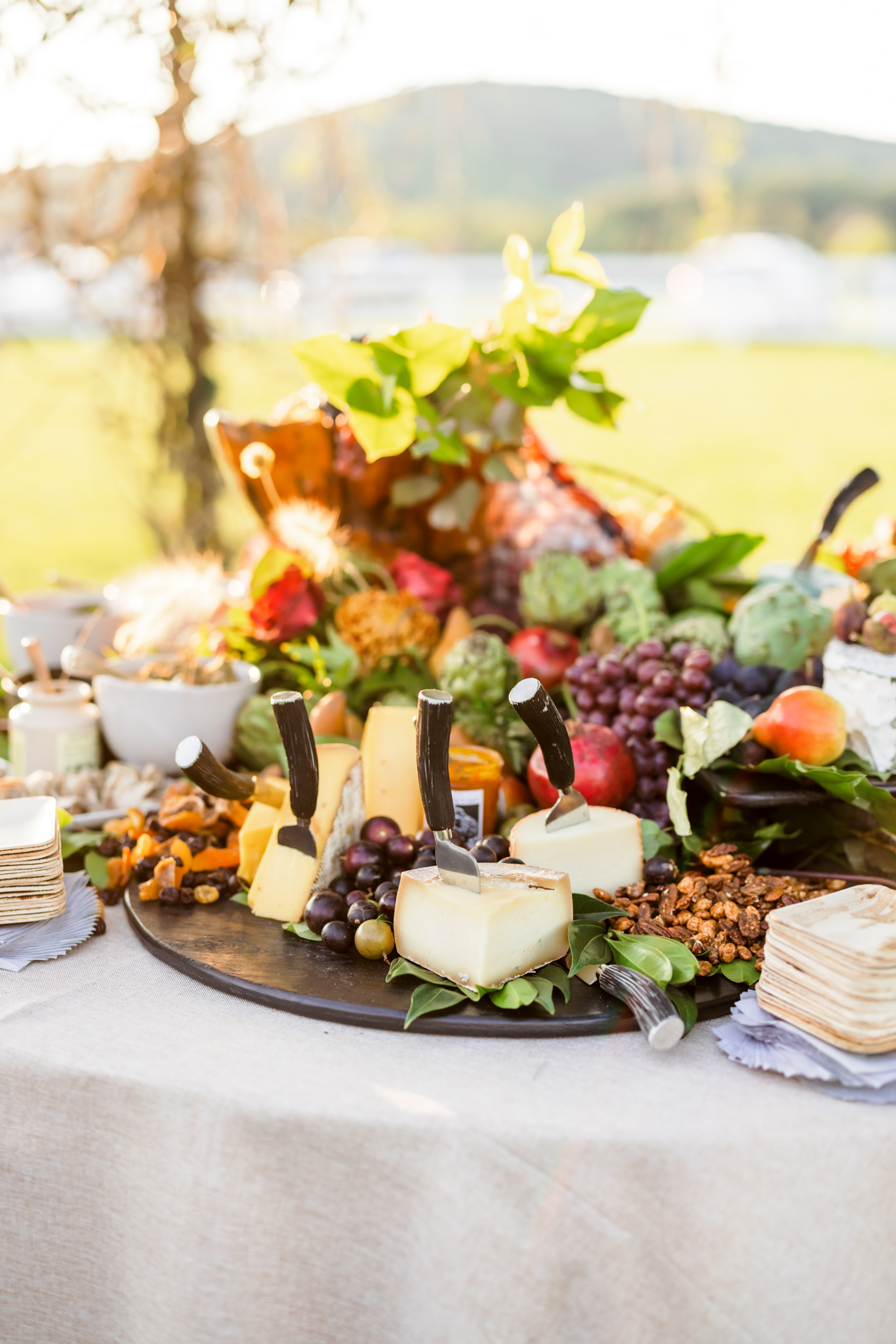 wedding centerpiece charcuterie board with florals 