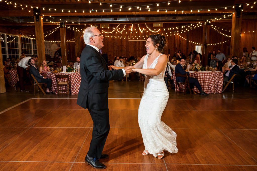 bride dancing with father during father daughter dance