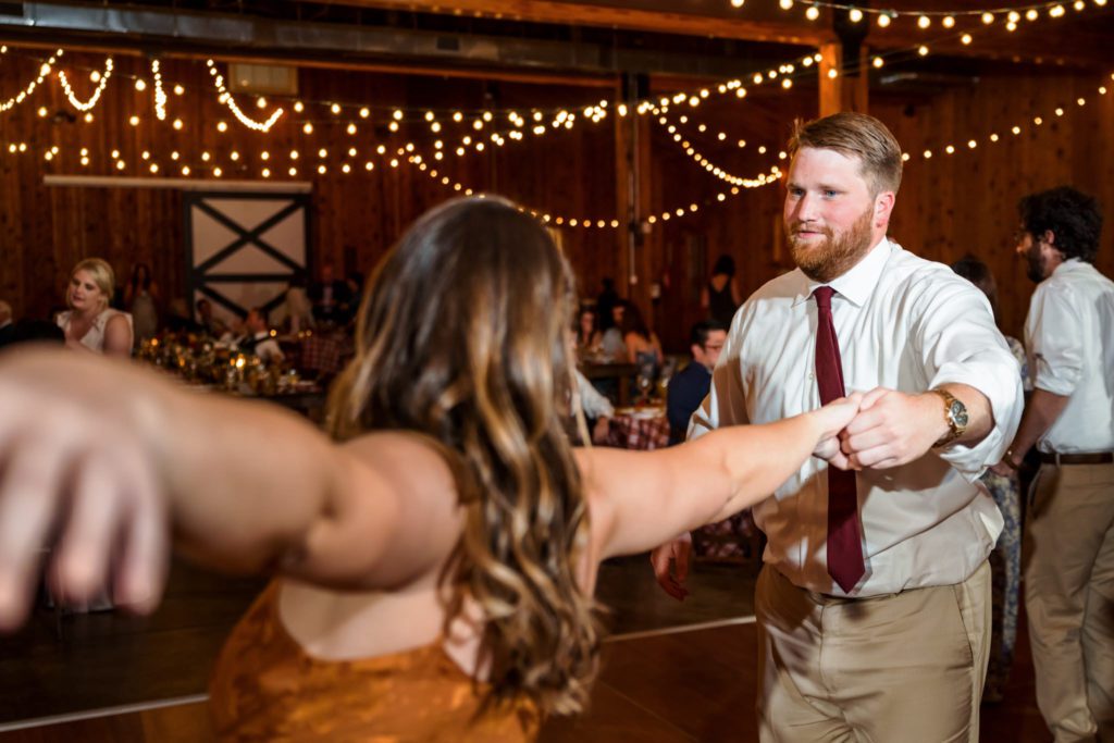 wedding guests dancing at fall castle hill cider wedding reception