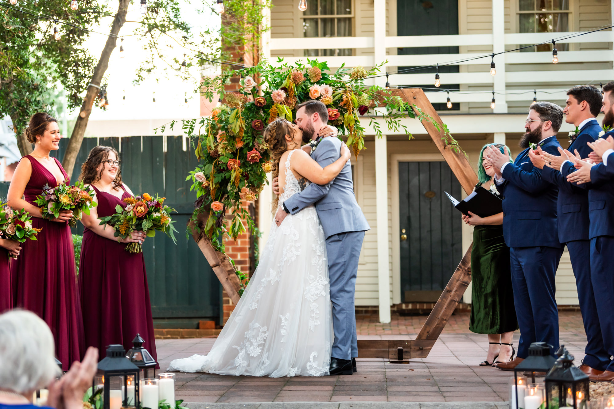 bride and groom kissing at their outdoor ceremony for their fall wedding at Lindon Row Inn