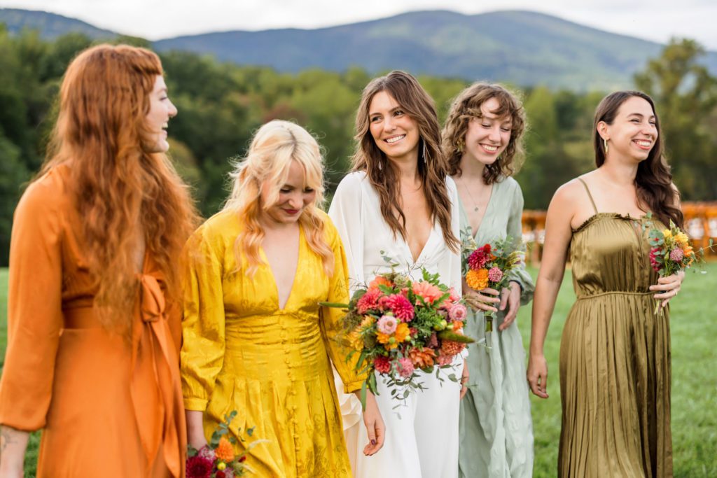 bride laughing with bridesmaids 