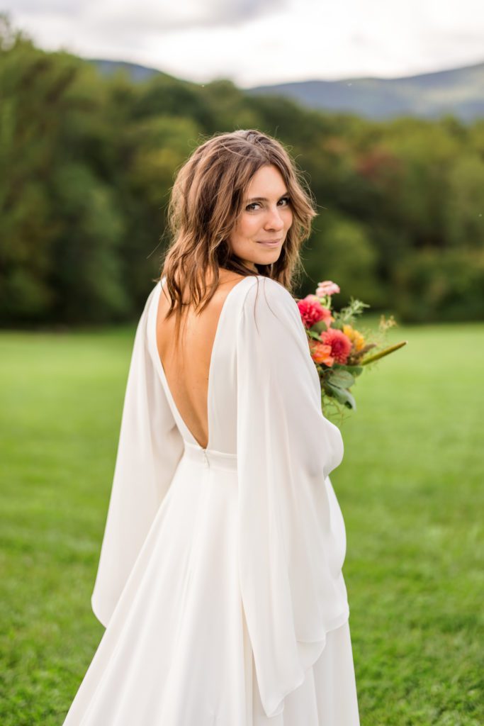 bride looking over shoulder with low back 