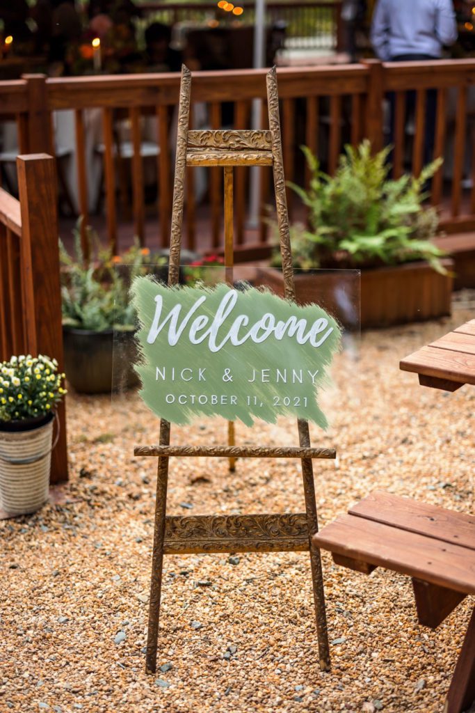 acrylic wedding 'welcome' sign with sage green 