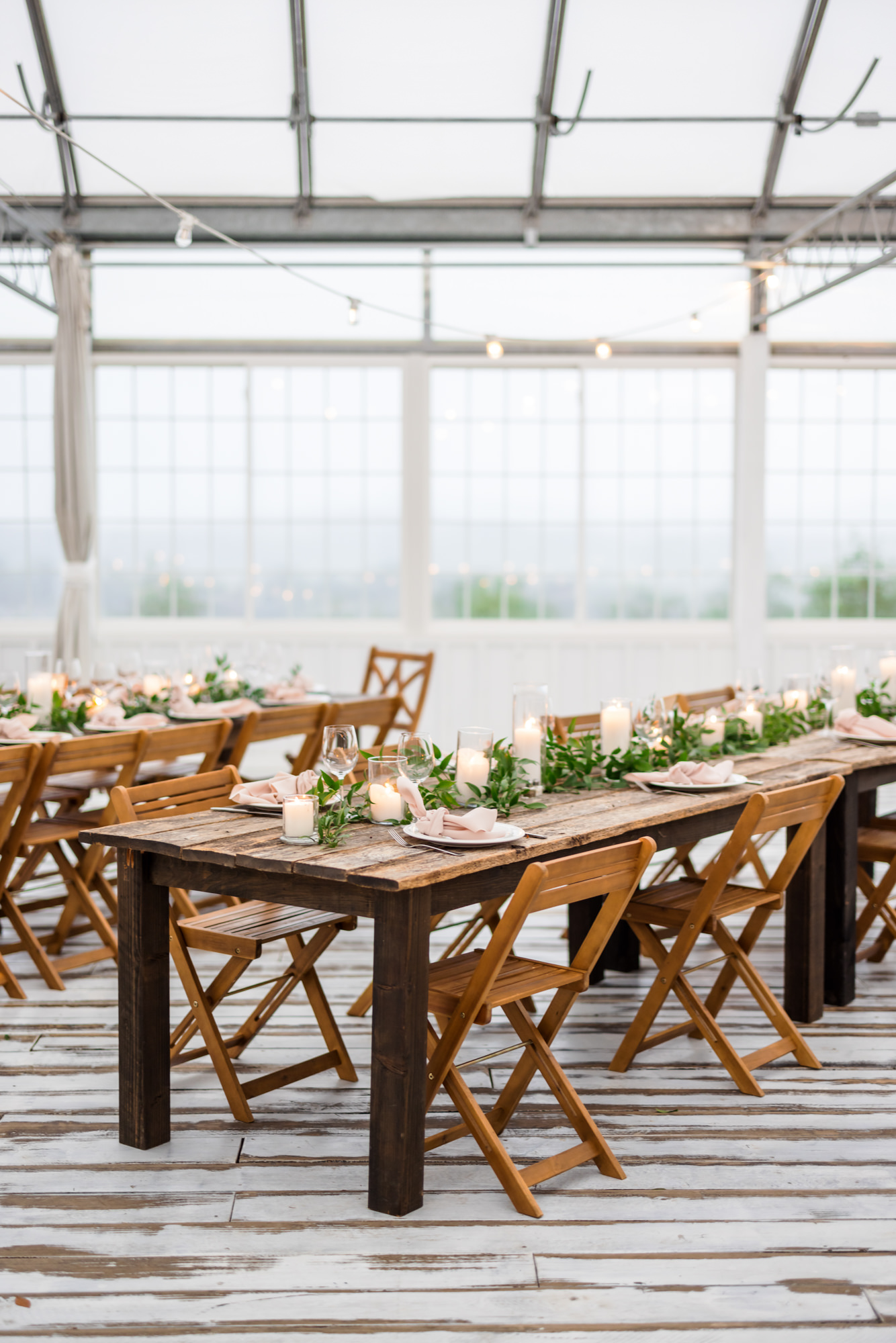 wooden table and chairs at showalters greenhouse wedding reception