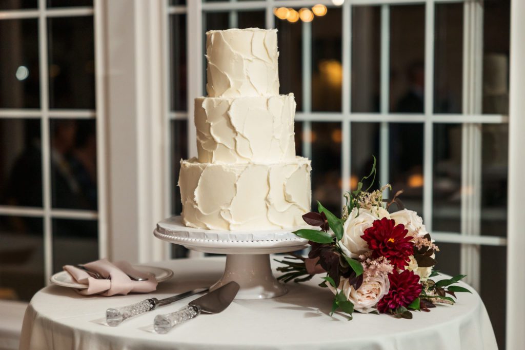 textured ivory three tiered wedding cake