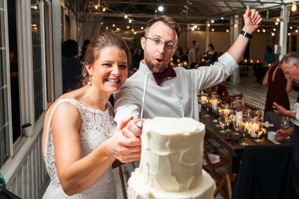 bridal couple cutting cake
