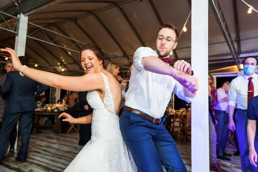 bride and groom dancing together on dance floor