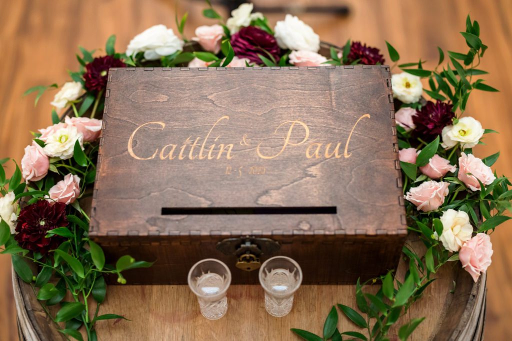 wooden box with couple's names on it for summer wedding ceremony
