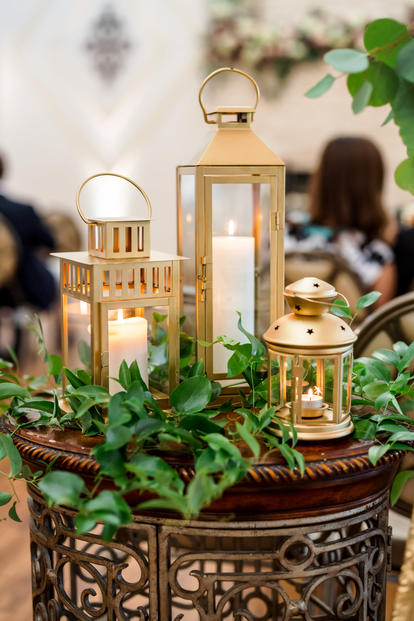 wedding ceremony decor with gold lanterns and candles 