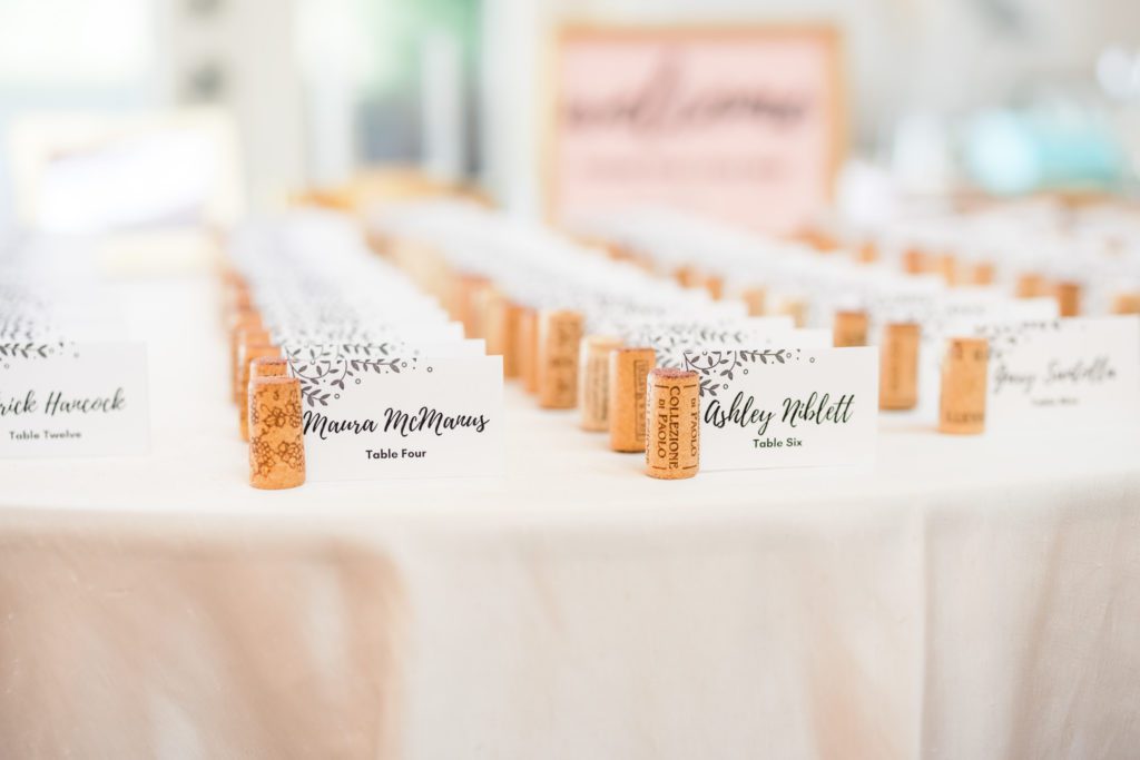 wedding seating chart with wine corks for each name tag
