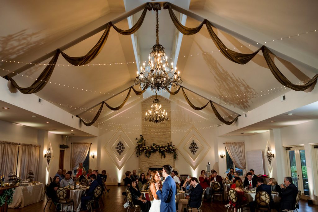 couple dancing at indoor wedding reception