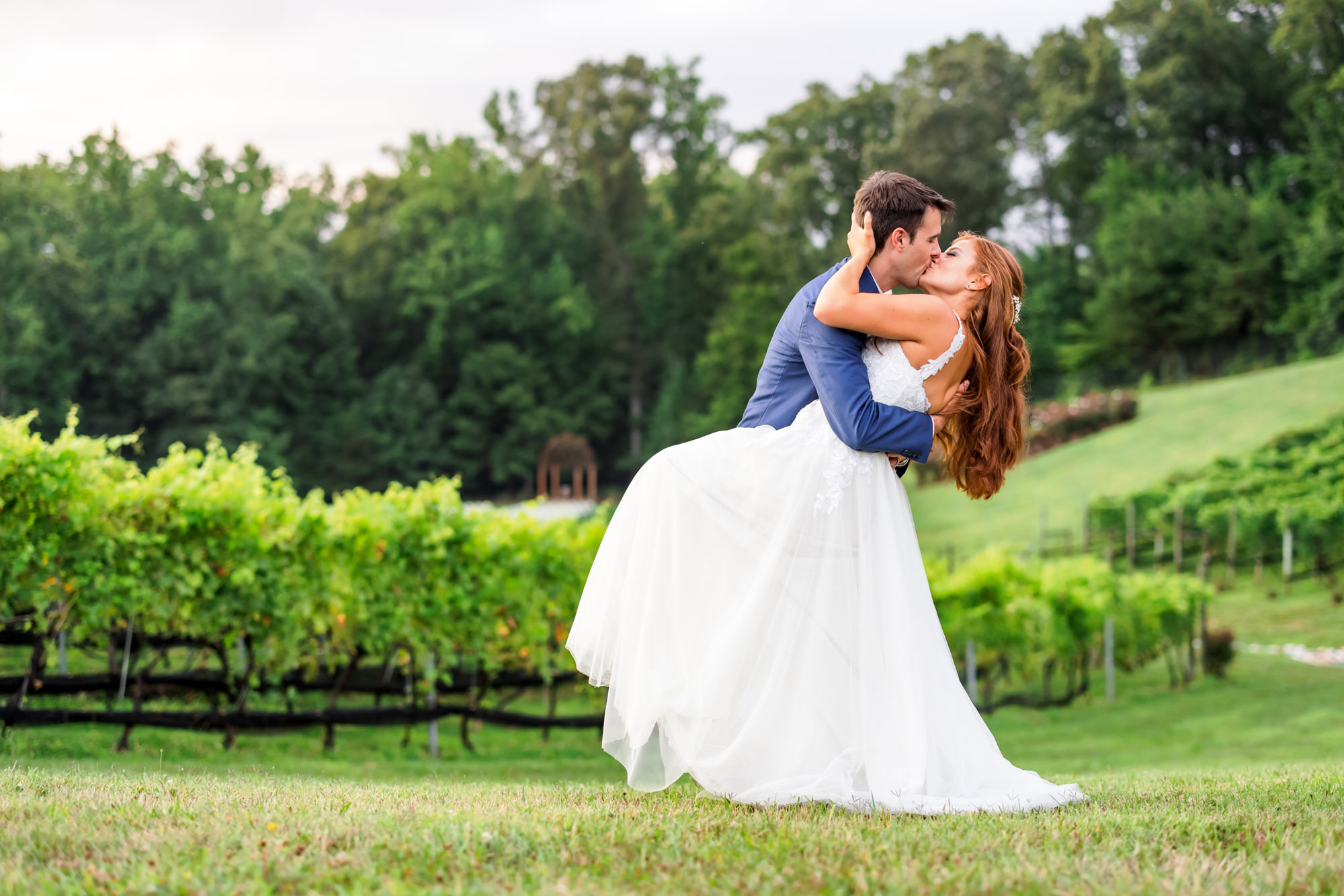 wedding couple kissing in potomac point winery