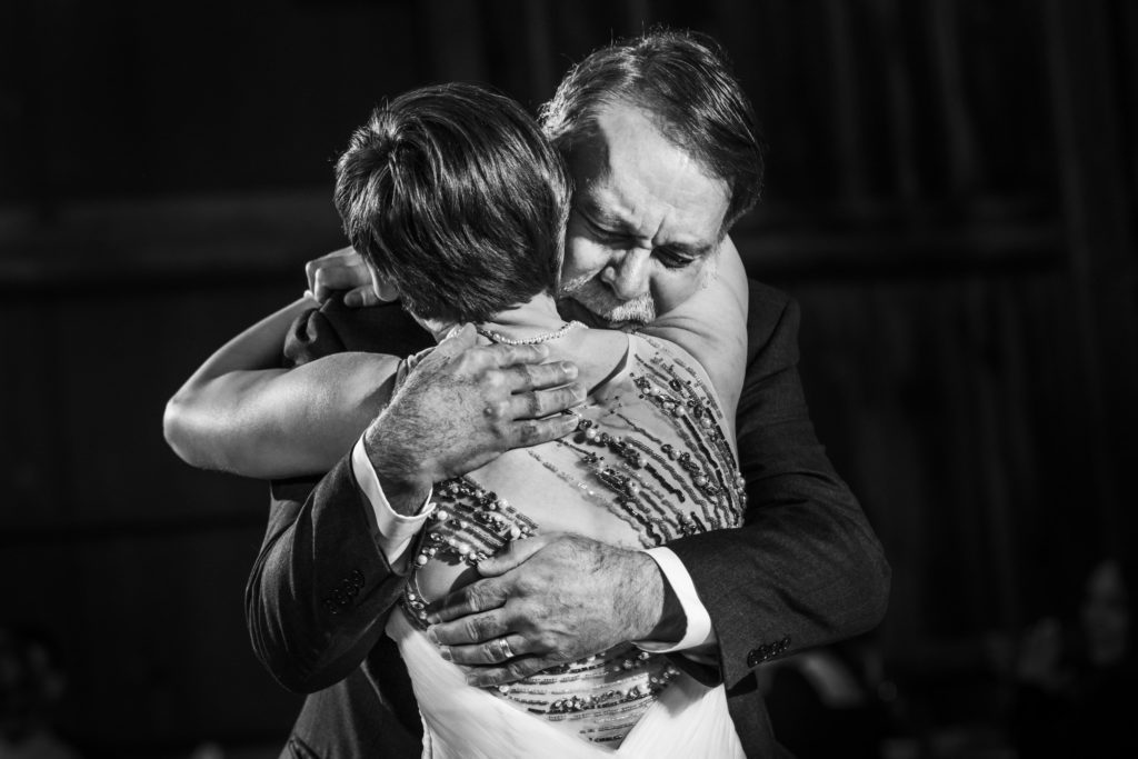 bride hugging father after emotional dance