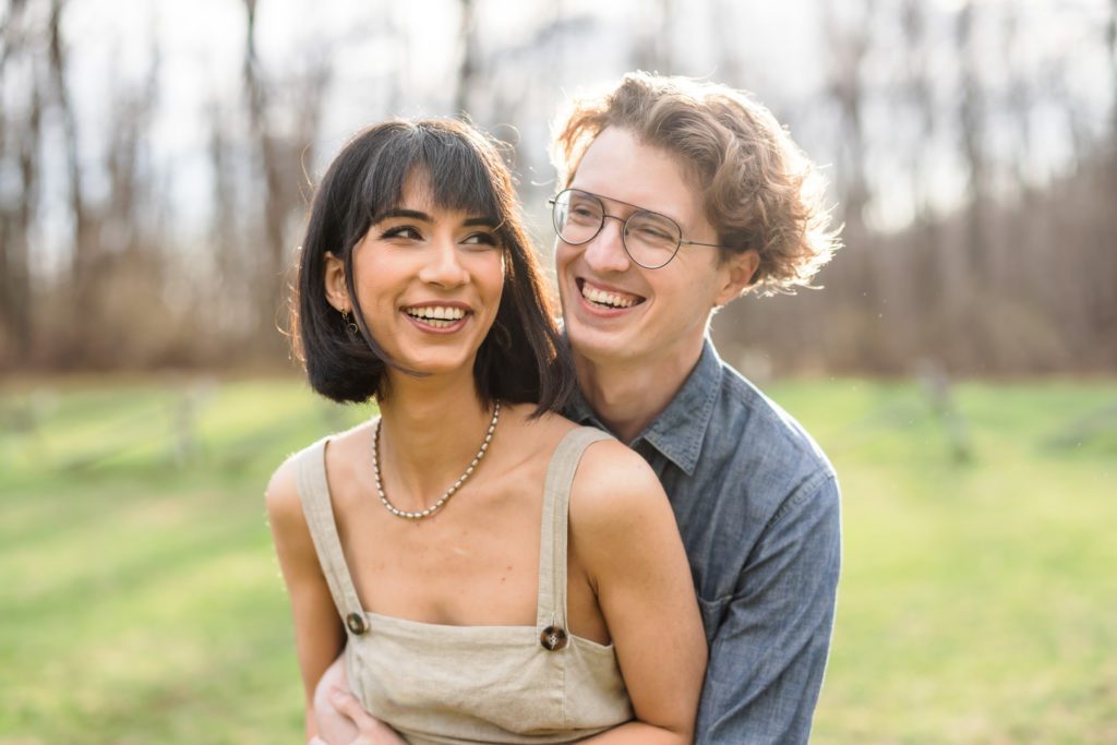 couple laughing and smiling during outdoor couples engagement session