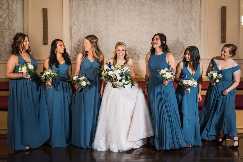 bride with wedding party during party portraits