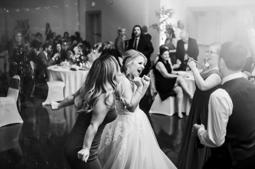 bride having fun with guests and laughing