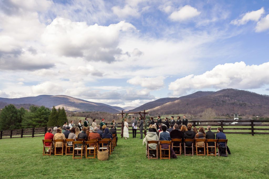 overview of outdoor spring wedding ceremony at montfair resort farm