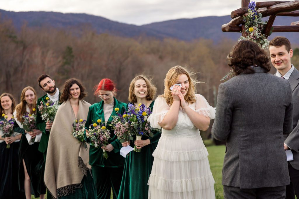 bride wiping away tears during emotional vows 