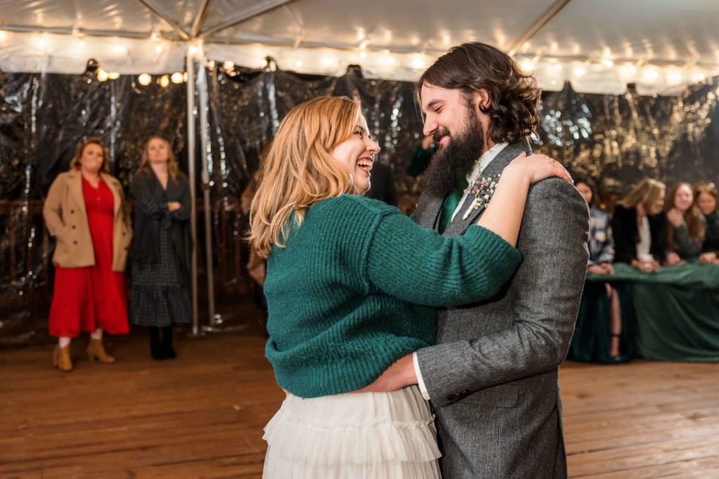 wedding couple dancing together for first time as married couple