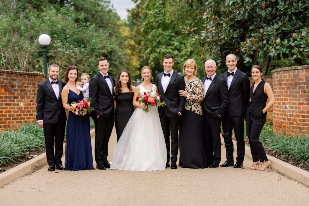 bride and groom standing with wedding party at UVA before Black Tie Wool Factory wedding ceremony