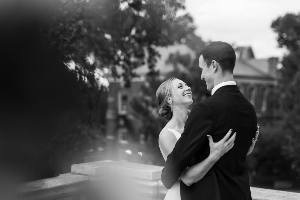 black and white portrait of couple embracing during bridal portraits at UVA 