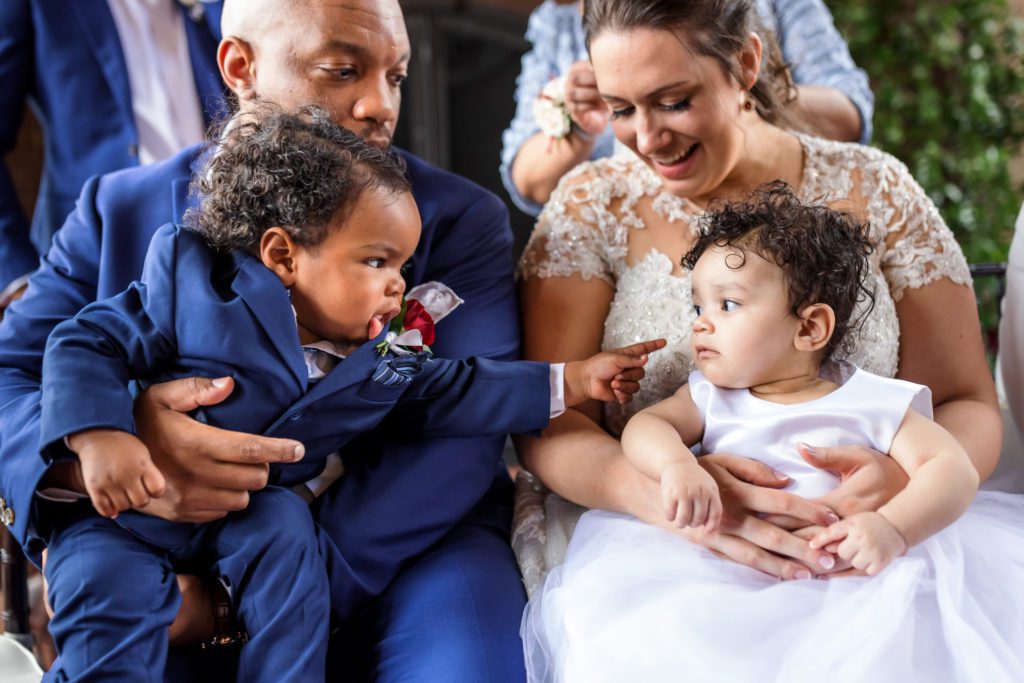 bride and groom holding children during spring Dover Hall Wedding 