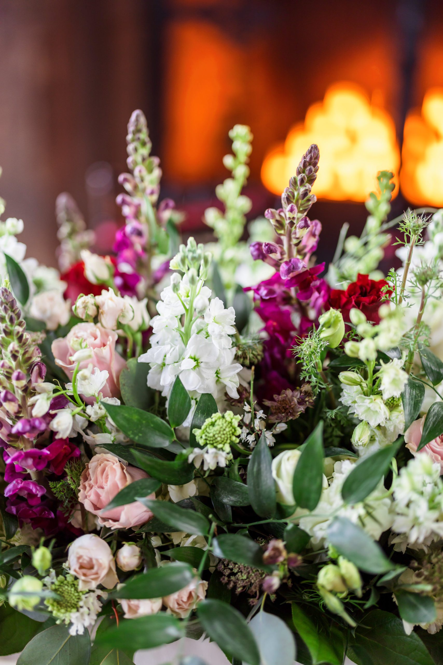 pink, burgundy, and white floral table centerpieces