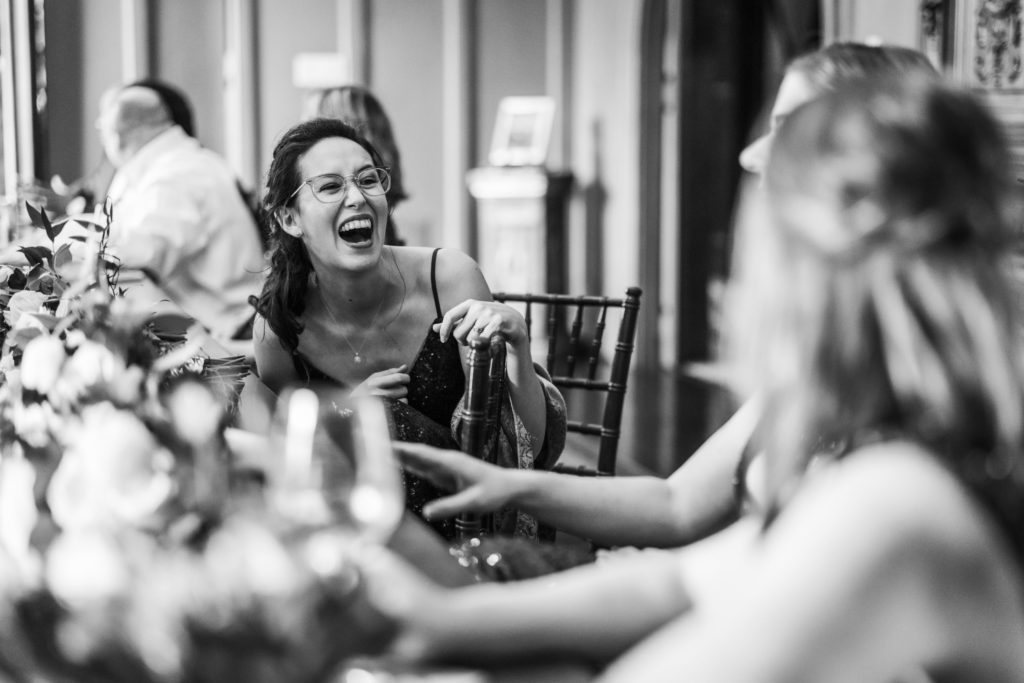 wedding guests laughing and having a good time at spring dover hall wedding reception 