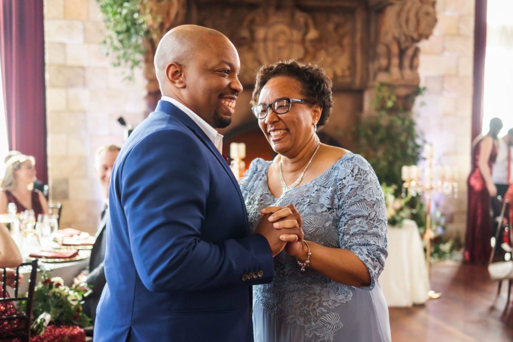 groom dancing with mother during mother-son dance at spring dover hall wedding reception