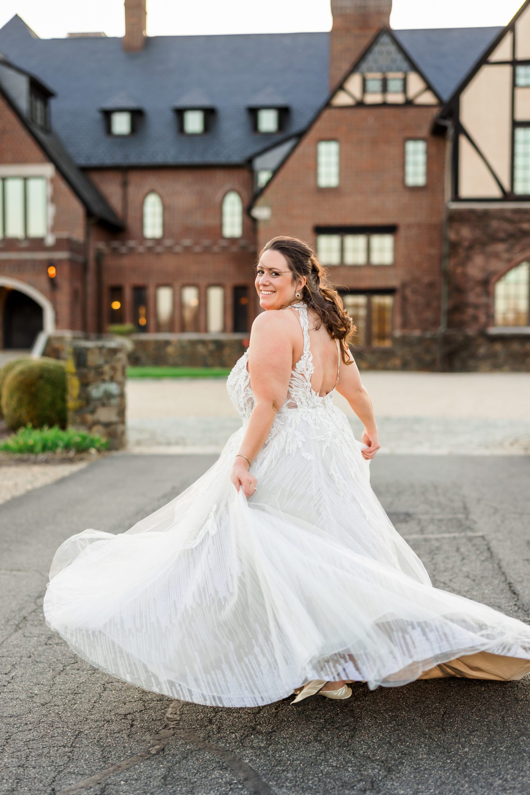 bride spinning dress and smiling on spring wedding day