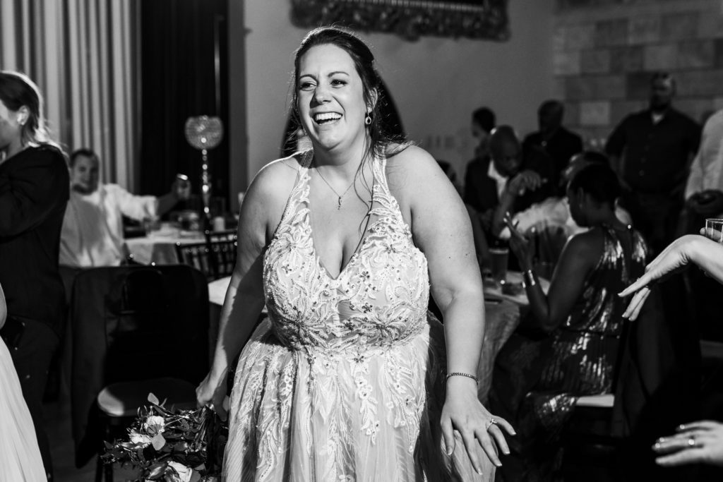 bride laughing and having a good time with friends and family 