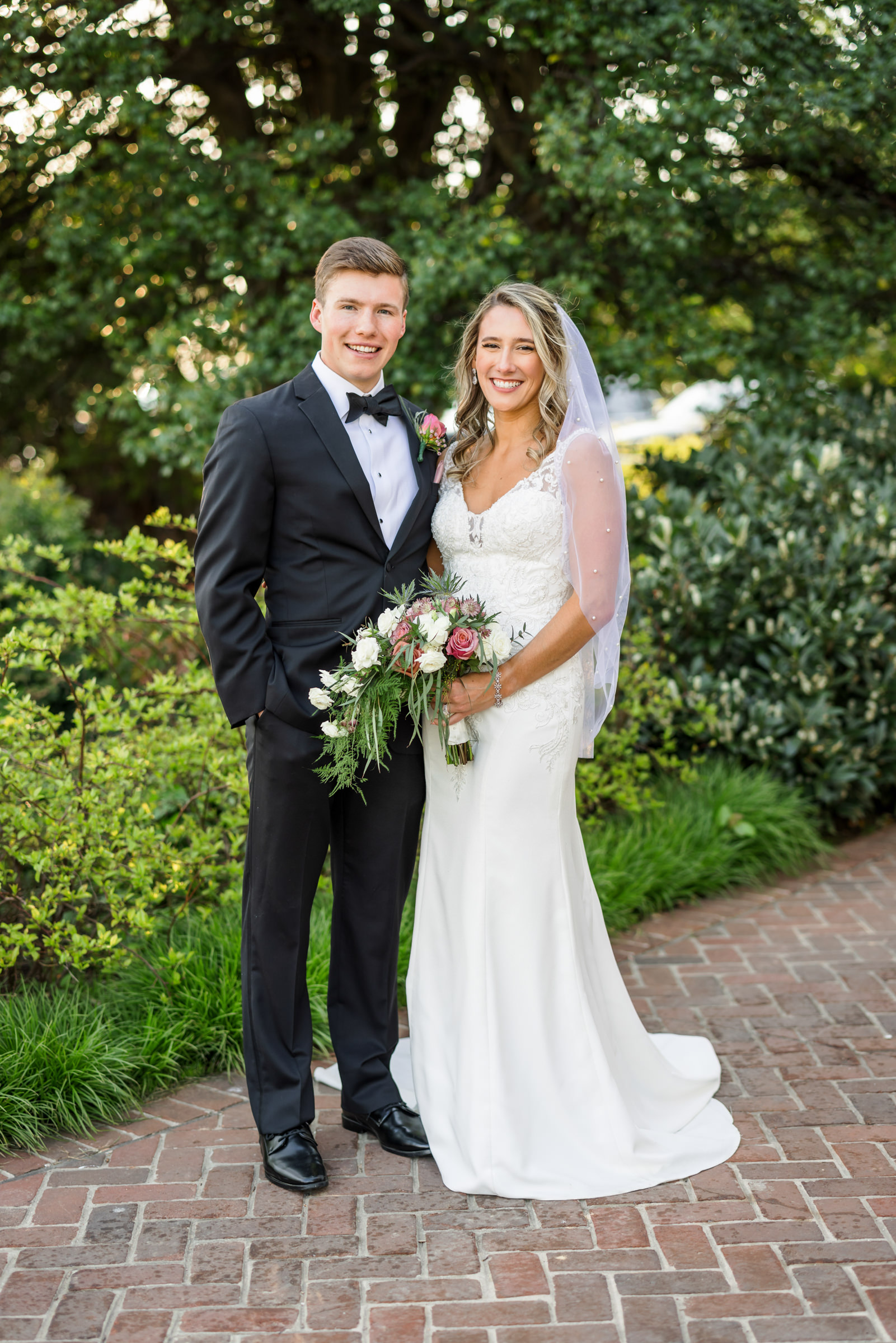 bride and groom standing together after black tie elegant spring washington golf and country club wedding during portraits