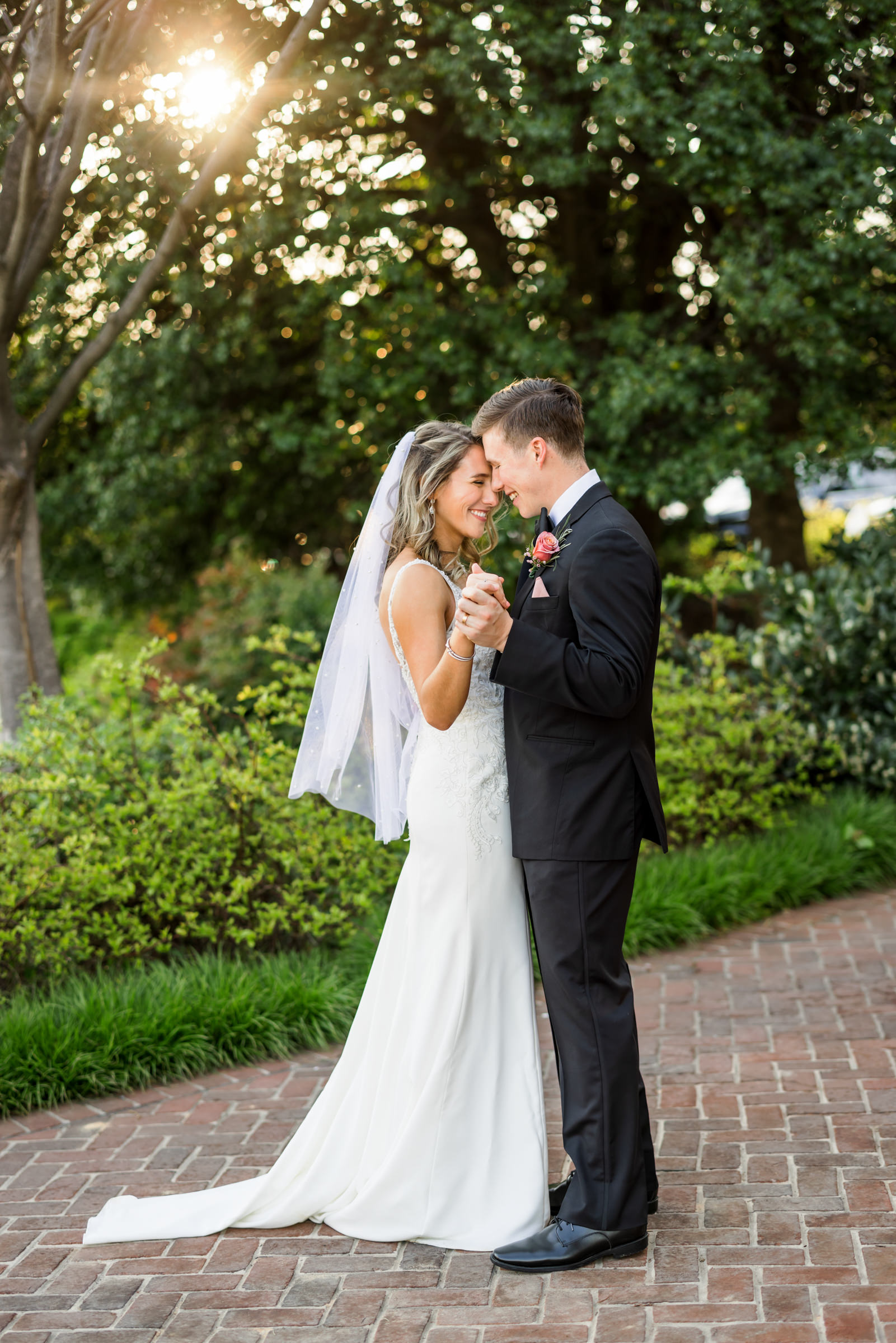 newly married couple dancing during sunset portraits at elegant spring washington golf and country club wedding