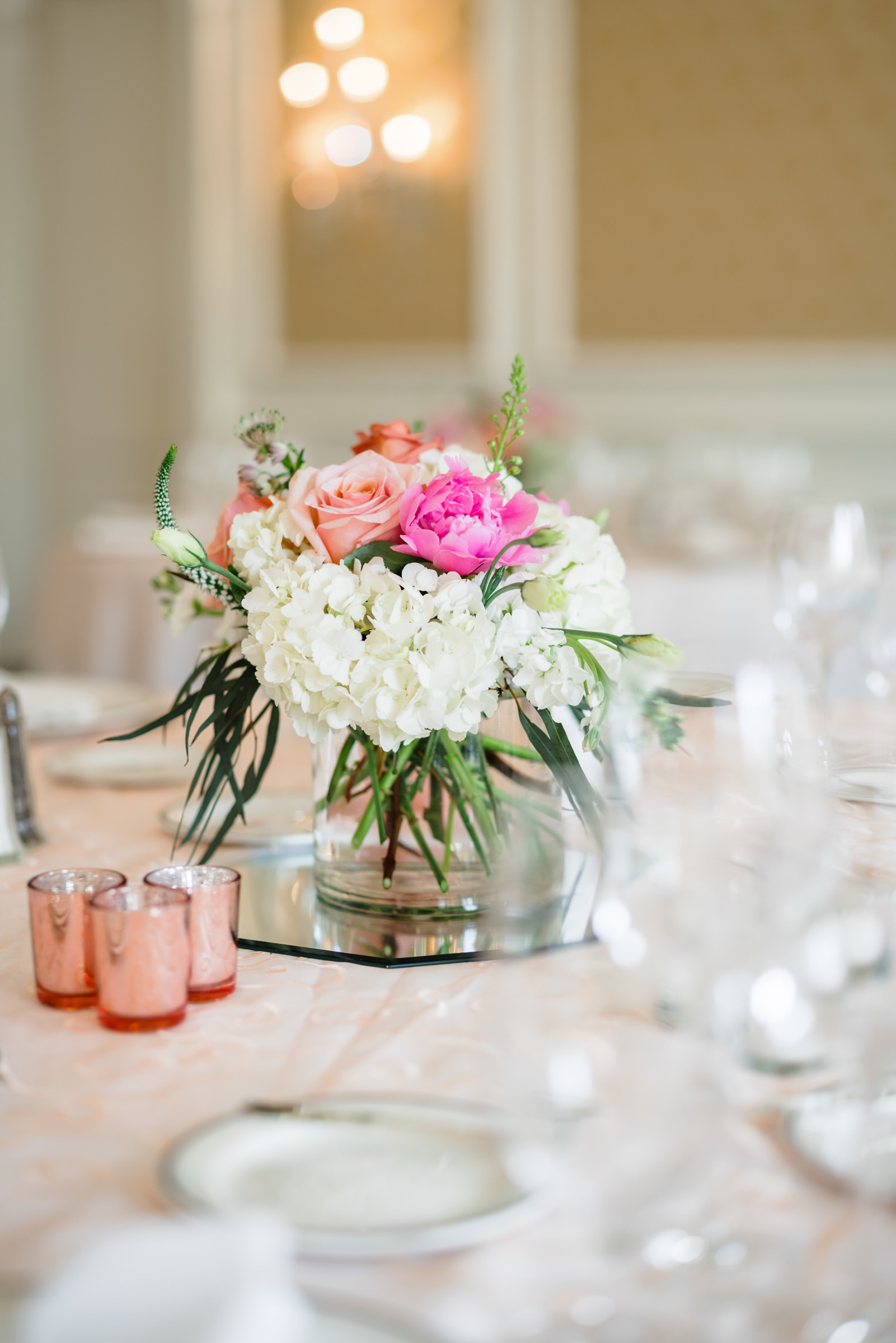close up of flower centerpiece with white and pink flowers