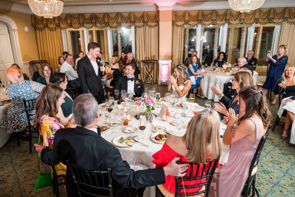 wedding guests sitting at table during wedding reception