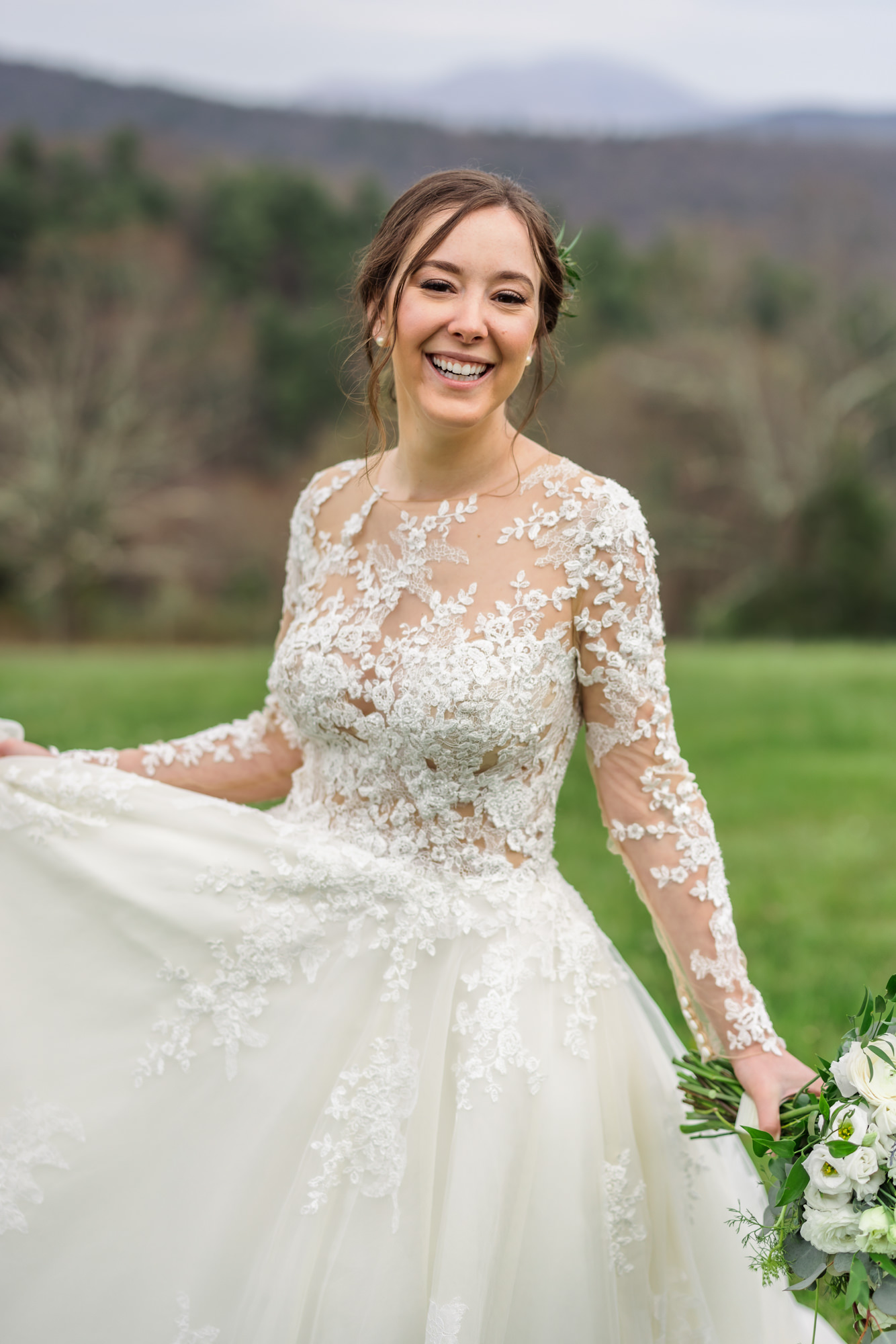 bride swinging dress around and smiling holding floral bouquet